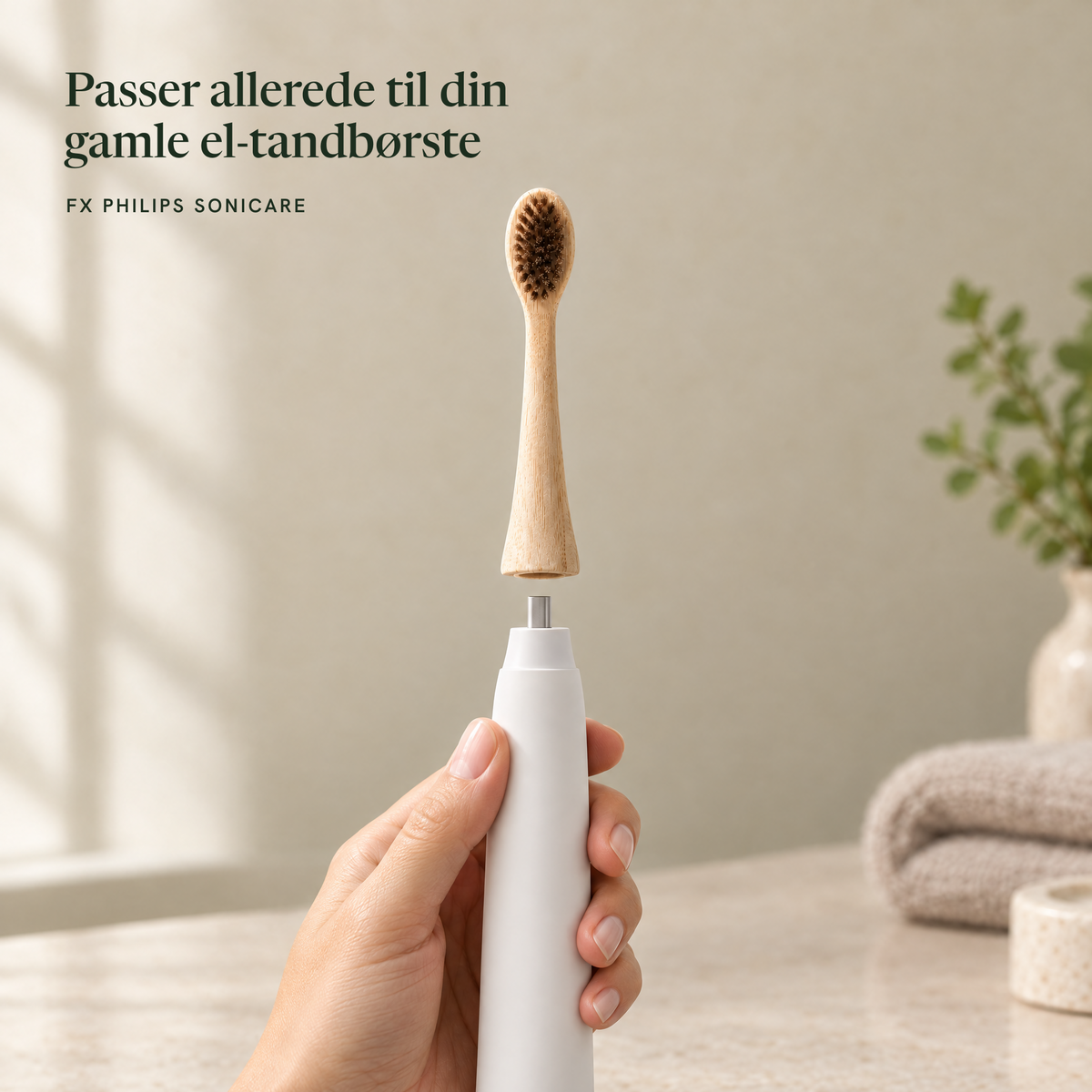 Bambushoved i naturhår der klikkes på en gammel el-tandbørste, fx Philips Sonicare